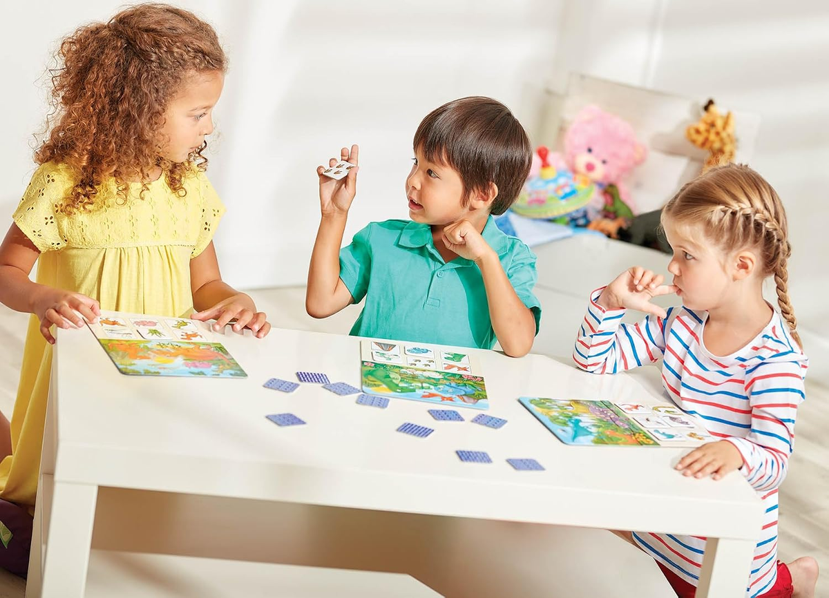 Children playing the Dinosaur Lotto matching game
